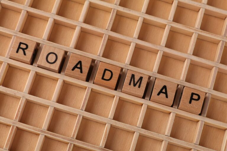 Wooden blocks spelling 'ROADMAP' on grid