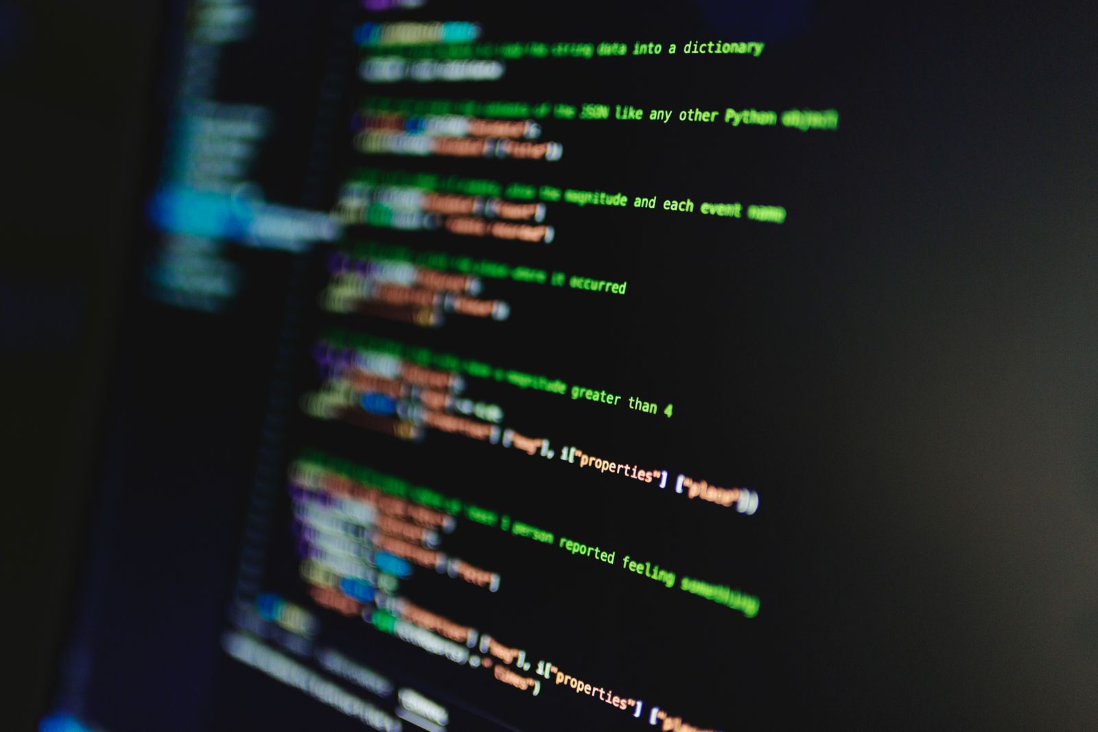 Python code on a dark screen parsing JSON earthquake data