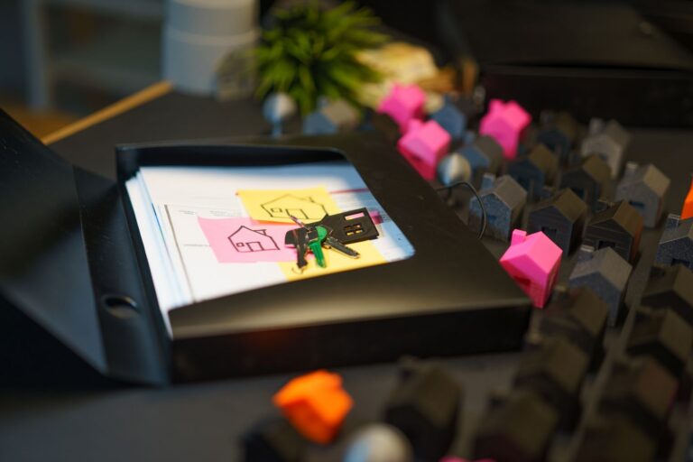 Real Estate Keys and Documents with House Models