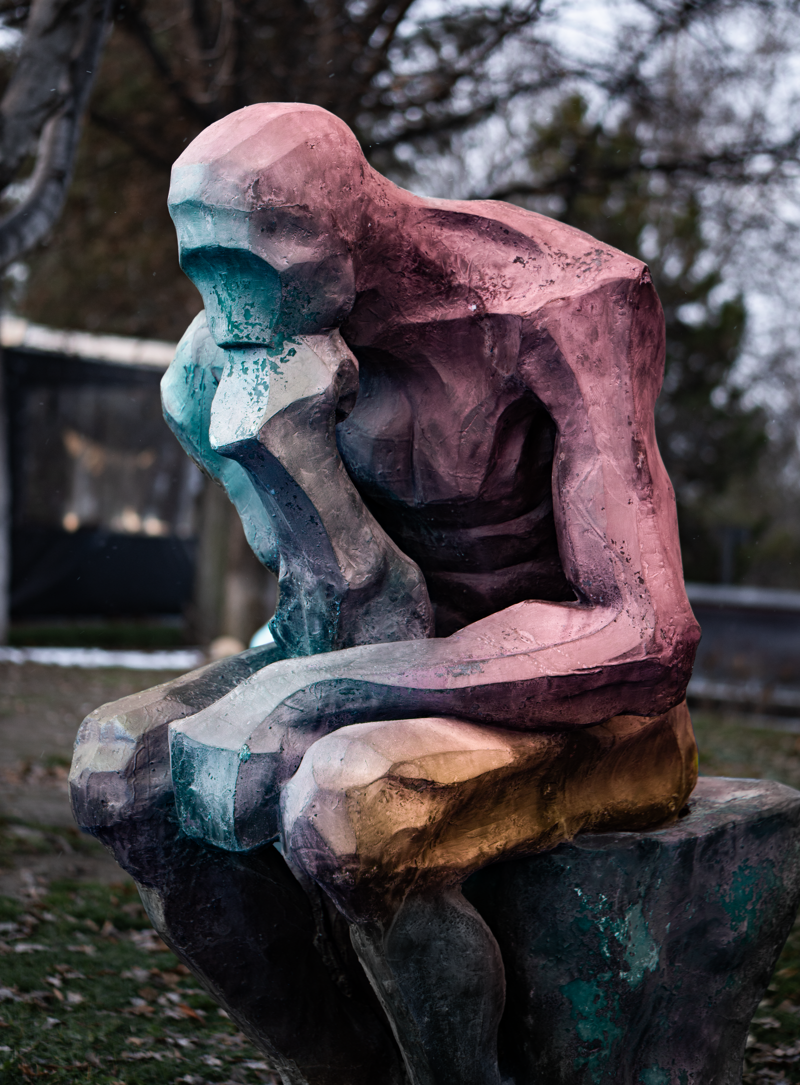 Colorful Modern Sculpture in Pensive Pose Outdoors