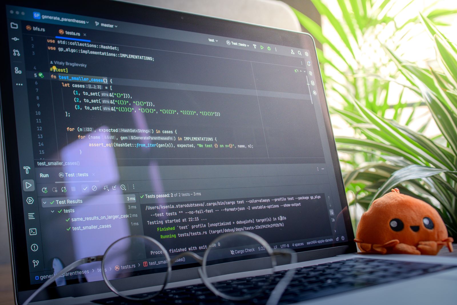 Modern Laptop with Code and Plush Toy in Bright Room
