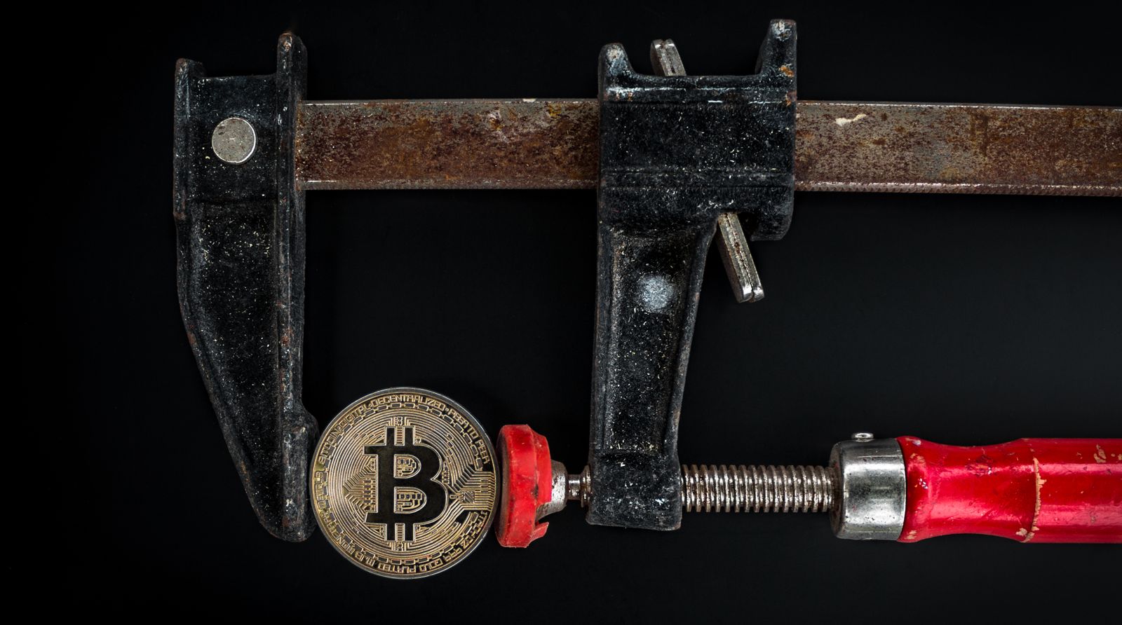 Black and Red Caliper on Gold-colored Bitcoin