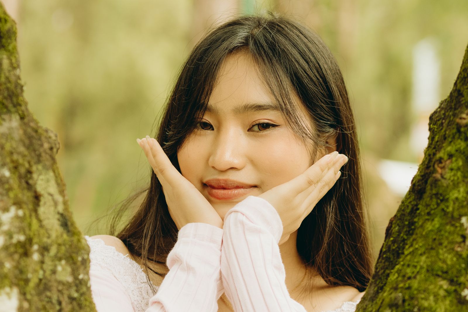 Woman Face Between Two Tree Trunks